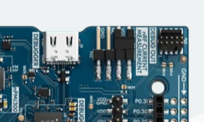 A 10-pin 1.27 mm Arm Cortex Debug header on a development board, silkscreened DEBUG OUT
